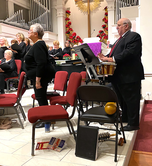 George working the bongos during last year's holiday concert.