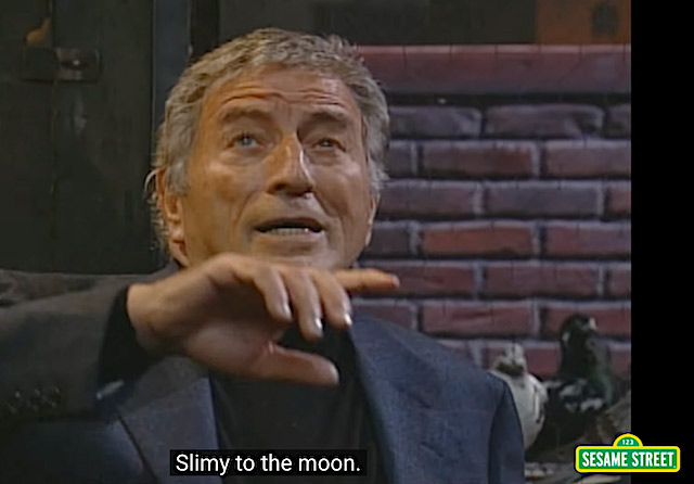 Bennett also had fun singing modified lyrics for a Sesame Street skit about a worm astronaut, in “Slimey to the Moon.”